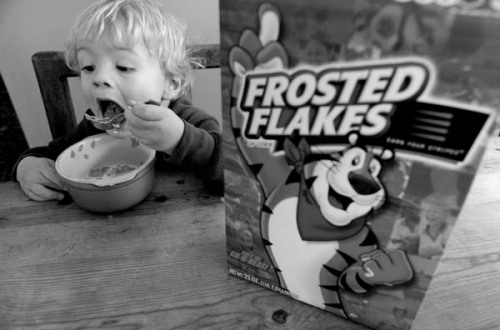 Theo has his first taste of Frosted Flakes....  I feel evil for introducing them to him!!!
